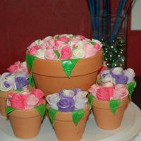 Flower Pot Cakes I made these for my son's school. I baked them in the pots. Some people wanted single servings and some wanted to share a larger cake...