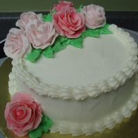 Mini Cake With Fondant Roses 5 inch cake with fondant roses. Chocolate cake with ganache filling and BCD icing. Took this to my doctor's office and they loved it...