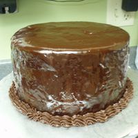 First Ganache Poured Cake... Okay, not so happy with how this turned out. :( But I know my co-workers will like it. :) This is the chocolate stout cake recipe with...