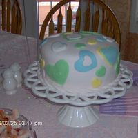 A Birthday About Hearts Birthday cake....Fondent with heart cutouts. Tons of fun making this cake!!! My 3 year old daughter helped too!!!Marble with Fudge center!...