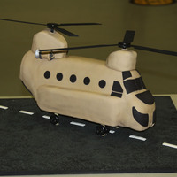 Chinook Ch47F Chocolate Sour Cream cake covered in fondant. Pylons are cake, Enginges are gumpaste. Base and blades are wood.I made for a ceremony...