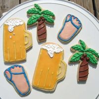 Summer Wilton's rolled cookie recipe. Palm trees are royal icing, flip flops and beer mug are powdered candy fondant icing. Need work on the...