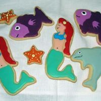 Mermaid, Dolphin, Fish No Fails with Wilton's Pour Cookie Icing. Couldn't figure out the mermaid cutter but in the end, I'm pretty happy with it....