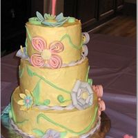 Spring Birthday Cake This is the cake for my daugther's first birthday. It was frosted in buttercream and had gumpaste and fondant accents.