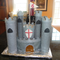 Colin's Castle My first castle cake! For my son's 6th birthday. I used 10-inch and 6-inch pans. Covered in MMF. I spent a lot of time looking at...