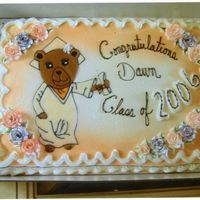 Graduation Bear The bear was drawn free-hand and my homemade buttercream icing was colored, melted down and piped into the photo.