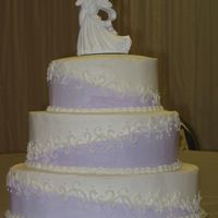 Purple Diagonal This was my first wedding cake. Mostly yellow cake with buttercream frosting. Middle section is marble cake.