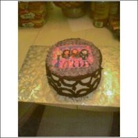 Bratz Cake my second stacked cake, 1st time using a rice paper decal.. and well needless to say by morning my rice paper cracked due to the top cake...