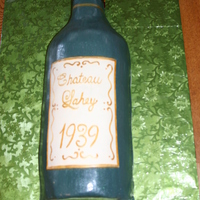 Wine Bottle White cake with buttercreamm icing. Used the birthday boys' name in the name of the wine and it was "bottled" the year he...