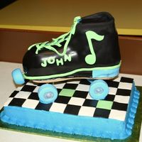 Rockand Roller Skate Skate is white cake covered with fondant. Floor is chocolate cake with buttercream sides, fondant checkerboard. Wheels were made of fondant...