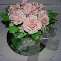 Dscn0711.jpg Gumpaste roses and filler flowers create a bouquet cake.