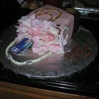 Shopaholic Birthday cake made for my friend. Shopping bag with Chanel items, all made out of gumpaste. Credit cards were an edible image.