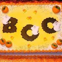Just A Fun Halloween Cake... Buttercream with color flow letters and ghosts and fondant pumpkins..