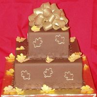 Chocolate Fondant With Gumpaste Bow And Fall Leaves I did this cake awhile ago...It was chocolate fondant, gumpaste leaves and bow. I don't know what I was thinking with the red...