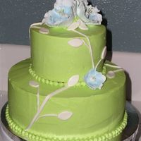 Green Bridal Shower WASC with lemon curd filling. Green buttercream and gumpaste flowers with fondant leaves. Made to match the invitation.