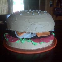 Hamburger Cake I made this for my son who was turning 14. All buttercream except for the tomato, onion and cheese, which were fondant. Thanks for the...