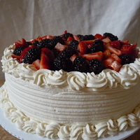 Fresh Fruit French Vanilla Creme cake with Strawberry mousse filling, strawberry preserves, frosted with stabilized whipped cream and topped with fresh...