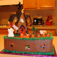 Haunted House Cake I made this cake for my twins' Halloween themed birthday party. I used the Wilton gingerbread haunted house kit.