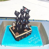 Pirate Cake Made this pirate cake for a little boy. The sails are bamboo shish-ka-bob sticks with paper, but the rest was edible.