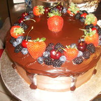 Chocolate With Fruit Topping Chocolate cake with chocolate frosting and ganache. soaked with a cointreau syrup. topped with black berries strawberries blue berries and...