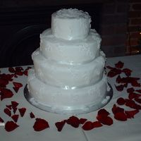 Wedding Cake This is the first wedding cake I've ever made. It is all pound cake, the flowers are made out of fondant.