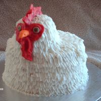 White Rooster Ii WASC cake with raspberry filling, covered in BC with fondant face. This one is better than my first attempt, on which the head ended up...
