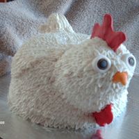 White Rooster WASC cake with raspberry filling, covered in BC with fondant face.