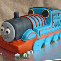 Thomas The Tank White cake covered in BC and fondant. First time with the fondant rope gun...amazing!! I love it! I was nervous about Thomas, but all in...