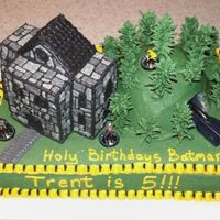 Batman Cake - Wayne Manor And Batcave This is a cake that I did for a close friend's child. It is Wayne Manor sitting next to a hill with the Batmobile coming out of the...
