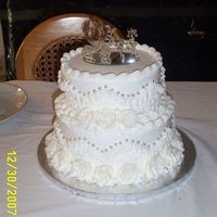 Wedding Cake For The Vaughns This is the first wedding cake that I've made. It is a 10" and 8", both tiers are french vanilla with strawberry cream...