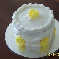 Leftovers This is a cake I threw together with leftover batter (french vanilla), filling (strawberry cream cheese), icing (BC), roses, dragees, etc....