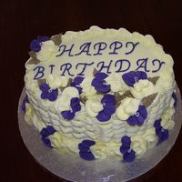 Pansy Passion This cake was made for a pansy lover. It is chocolate pound cake, with chocolate buttercream filling. Buttercream basketweave and border,...