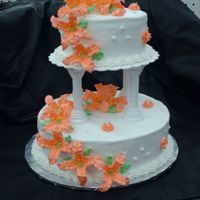 Lillies In Bloom This is a white cake with buttercream. 10" bottom 6" top. The lillies, leaves and dots are all made from royal icing. This is my...