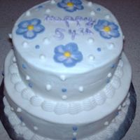 Pict0057.jpg yellow cake with buttercream icing. Flowers on top are embrodery they are purple not blue.