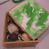 Cookie Box Edible cookie boxes with flooded RI on the lid, filled with assorted truffles