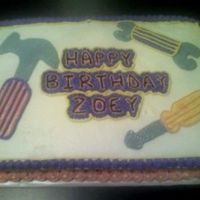 Tools-Girl's Cake For 2 yr-old little girl who loves to play with tools. 9x13 chocolate cake with buttercream,torted. I did the tools freehand.