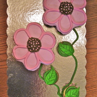 Flower Cupcake Cake I have been wanting to make this one for a long time! Thanks to Turtlecakes for the design which I totally copied. This one was easy and...