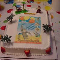 Curious George Cake for my daughter's 3rd birthday. Chocolate cake with whipcream filling and frosting. I made the edible image and got a deco pac of...