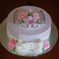 Princess Whipped cream icing with fondant roses and bow. Tiara is plastic.