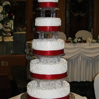 Grande Scrolls Bride and groom were easy to work with and actually very plain and simple. I talked them into the scroll work and red ribbon around the...