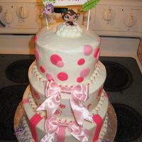 Pink W/ Monkeys WASC w/ buttercream icing and fondant accents. The monkey on the top was from littlest pet shop.