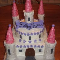 Img_1056.jpg castle cake. towers made of mmf and covered in mmf. 2 tier 12" square bottom and 10'" round top.