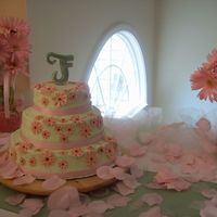 My Wedding Cake Buttercream with MMF flowers. Wish I could of gotten the frosting smoother, but I had to leave right after I initially frosted it and I now...
