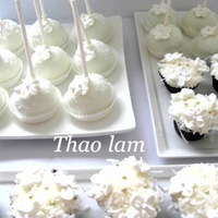 Cake Pop And Cupcakes flowers are made from royal icing. white chocolate red velvet cake pops and red velvet cuppies dipped in shredded coconut