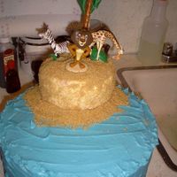 Madagascar Island white cake w/ almond BC... took the pic B4 I added the penguins... and before the island split in half & fell off on the way to deliver...