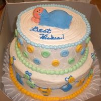Sleeping Baby I loved doing this one! The cake was made to go with the "clothes line" baby shower theme. Each button and piece of clothing was...