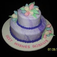 Rosalie's Retirement My first attempt at the rolled fondant roses (I think that's what they are called). This did not come out perfect, but I fairly...