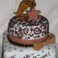Lil' Buckaroo Baby shower cake made for my nephew on the way. Horse is gumpaste... a bit of a disaster (the star is there to cover up how uneven the...