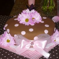 Haylie's Cake All fondant with satin bow and real flowers.