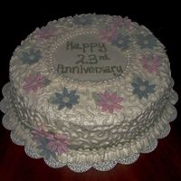 25Th Anniversary Choc. cake w/ bc and fondant flowers.